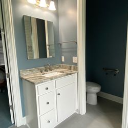 J & R Construction Services - Bathroom Remodel in Lexington KY - Quartz countertop - recessed medicine cabinet - light fixtures - reuse existing vanity - tile flooring