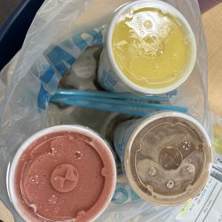 Tropical Smoothie Cafe - Mango magic (top), paradise point (bottom left), and peanut butter cup (bottom right) smoothies.