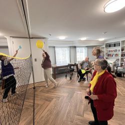 Plum Creek Supportive Living - This is one of the many activities offered, balloon flyswatter tennis.
