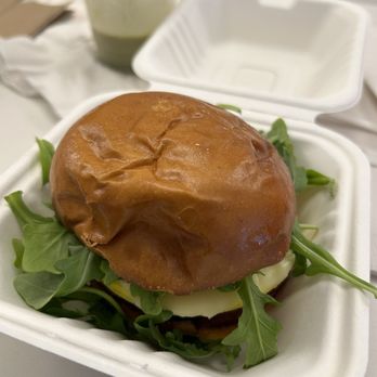 The Surf Block Island - Egg and cheese sandwich with arugula and avocado on a brioche bun - American Near Me - New Shoreham, Rhode Island