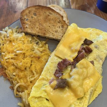 Rise Cafe - Mixed grill omelette with ham, bacon, and sausage. Could have used more cheese. - Breakfast & Brunch Near Me - Huntersville, North Carolina Rise Cafe - Mixed grill omelette with ham, bacon, and sausage. Could have used more cheese. - Breakfast & Brunch Near Me - Huntersville, North Carolina