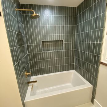 Quintessence Tile - a bathtub in a bathroom - Flooring Near Me Quintessence Tile - a bathtub in a bathroom - Flooring Near Me