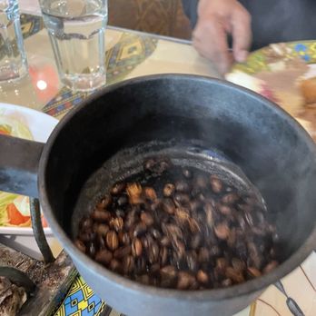 Lalibela Cuisine - Showing us the roasted beans. Smelled so good - Ethiopian Near Me - Toronto, Ontario Lalibela Cuisine - Showing us the roasted beans. Smelled so good - Ethiopian Near Me - Toronto, Ontario