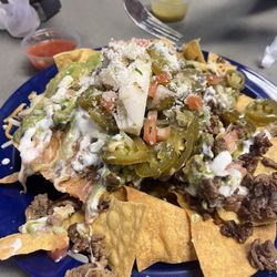 Los Capitanes Mariscos y Taqueria - I ordered the Carne Asada nachos was very disappointed.