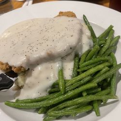 Chicken Fried Steam, green beans, on a bed of mashed potatoes