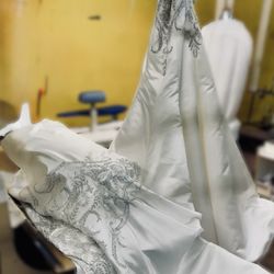 Wedding gown spot treated & dry cleaned--embroidery brightened, fabric refreshed. Bridal gown cleaning Irvine.