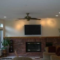 All-Tronics Video & Audio - Mounted TV above fireplace. Wires and equipment concealed.