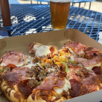 The Pizza House - a half eaten pizza and a glass of beer - Pizza Near Me - Happy Camp, California The Pizza House - a half eaten pizza and a glass of beer - Pizza Near Me - Happy Camp, California