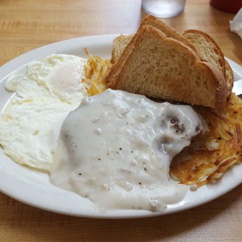 Country Cookin Cafe - Chicken fried steak and eggs, with a single bite taken out of it because I almost forgot to take the pic before eating it. - Breakfast & Brunch Near Me - Beatrice, Nebraska