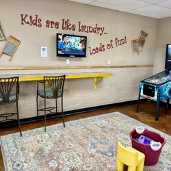 Washboard Laundry & Dry Cleaning - Children's Play Area, Phone Charging Stations, TV, and Pinball