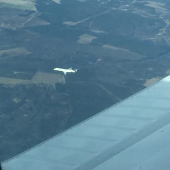 Andrews Airport - Another plane flying opposite direction, while flying to the airport. - Airports Near Me - Andrews, South Carolina