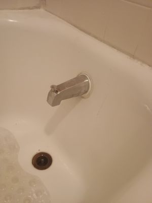 Tub repair - This repair was completed in January 2025. The customer had been with out their tub spout for several months before speaking with us. An access hole from the hallway was required in order to make this repair. Once the new spout was installed, we patched the hole and finished painted after the spackle work was complete.