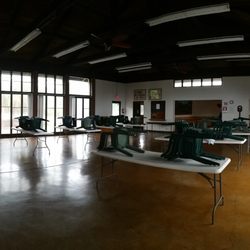 Hilo Woman's Club - Tables and chairs await your next gathering! There is also a stage for music or guest speakers