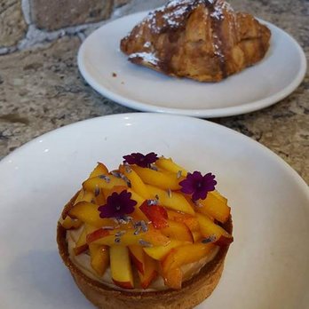 Floriole Cafe & Bakery - Peach Fruit Tart (with an Almond Croissant in the back) - Bakeries Near Me - Chicago, Illinois Floriole Cafe & Bakery - Peach Fruit Tart (with an Almond Croissant in the back) - Bakeries Near Me - Chicago, Illinois