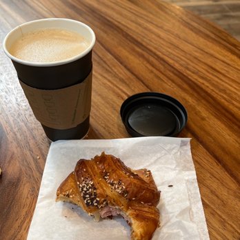 Spyhouse Coffee Roasters - a half eaten pastry and a cup of coffee - Cafes Near Me - Minneapolis, Minnesota Spyhouse Coffee Roasters - a half eaten pastry and a cup of coffee - Cafes Near Me - Minneapolis, Minnesota