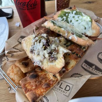 Wild Tomato - Variety bread basket- really generous portion and all delicious - Pizza Near Me - Fish Creek, Wisconsin Wild Tomato - Variety bread basket- really generous portion and all delicious - Pizza Near Me - Fish Creek, Wisconsin