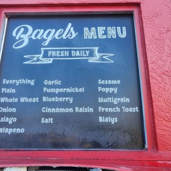 Dunedin Bagels & Deli - Menu outside on the back/storage building - Delis Near Me - Dunedin, Florida