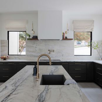 Casa Sisu - Soft white cabinetry, warm walnut accents, and Fantasy Lux quartzite come together to create a kitchen that feels both refined and inviting - Interior Design Near Me Casa Sisu - Soft white cabinetry, warm walnut accents, and Fantasy Lux quartzite come together to create a kitchen that feels both refined and inviting - Interior Design Near Me