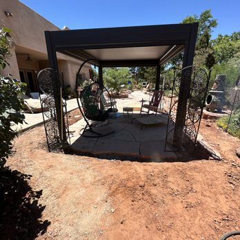 Landaverde Landscaping - a patio with a pergolated roof - Landscaping Near Me Landaverde Landscaping - a patio with a pergolated roof - Landscaping Near Me