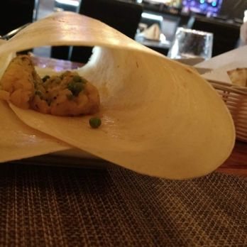 The Himalayan Chimney - Inside the dosa. I believe that is the same mixture they put in the samosa. Not sure...still yummy though. - Indian Near Me - Champaign, Illinois