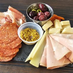 Grazing Fields Cheese and Charcuterie - Prosciutto, pepperoni, mortadella, parmesano reggiano, and a nice sheep's cheese basque. Dried apricots, whole grain mustard, and olives.