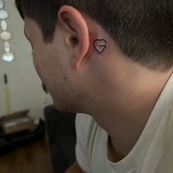 Designer Tattoos - My fiancé got a heart shaped G for me.