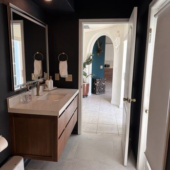 Simple Remodel - Fully remodeled bath with floating vanity, lighting, mirror, improvements to the walls, and reduced bulkhead for a more open layout - Cabinetry Near Me - Cocoa, Florida