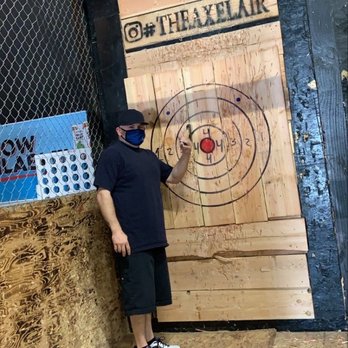 The Axe Lair - Hubby doing his thing - Axe Throwing Near Me - Upland, California