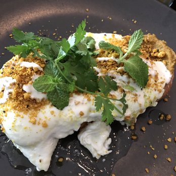 Indulge - Moorish eggs -Turkish toast, roast pumpkin hummus, eggs poached in lemon and butter, macadamia dukkah, garlic yogurt. - Restaurants Near Me - Bundaberg, QLD