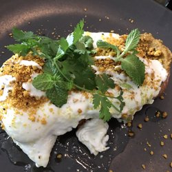 Indulge - Moorish eggs -Turkish toast, roast pumpkin hummus, eggs poached in lemon and butter, macadamia dukkah, garlic yogurt.
