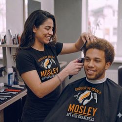 Mosley School Of Cosmetology - Student cutting hair.