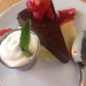 Sava's - Flourless chocolate cake with cre me anglais and a side of mint cream. - Bars Near Me - Ann Arbor, Michigan Sava's - Flourless chocolate cake with cre me anglais and a side of mint cream. - Bars Near Me - Ann Arbor, Michigan