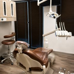 Modern dental treatment suite with advanced lighting and equipment