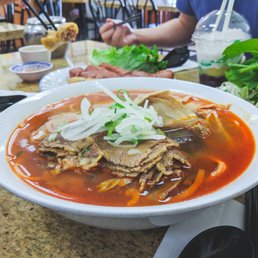 Bun Bo Hue (L). Che ba mau, cha gio, and nem nuong in the background. Bun Bo Hue (L). Che ba mau, cha gio, and nem nuong in the background.