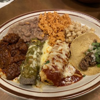 La Tertulia - Combination plate. Beef taco, beef tamale with red chile, chicken enchilada with green chile, carne adovada, rice and beans. Incredible. - New Mexican Cuisine Near Me - Tulsa, Oklahoma La Tertulia - Combination plate. Beef taco, beef tamale with red chile, chicken enchilada with green chile, carne adovada, rice and beans. Incredible. - New Mexican Cuisine Near Me - Tulsa, Oklahoma