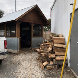Rusty’s BBQ Smokehouse - Wood stack and smoker