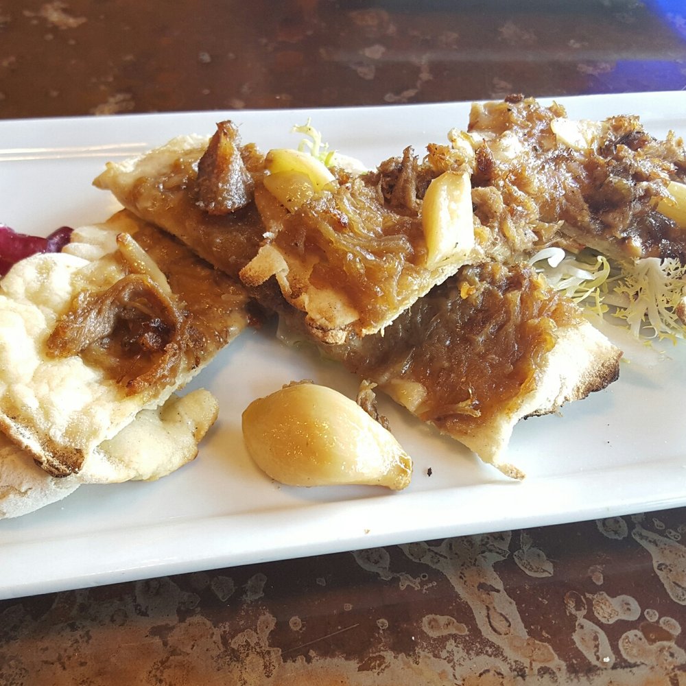 Wine & Growl - Hog Wild carnitas with caramelized onions, roasted garlic and taleggio cheese. - Tapas/Small Plates Near Me - Portland, Oregon Wine & Growl - Hog Wild carnitas with caramelized onions, roasted garlic and taleggio cheese. - Tapas/Small Plates Near Me - Portland, Oregon