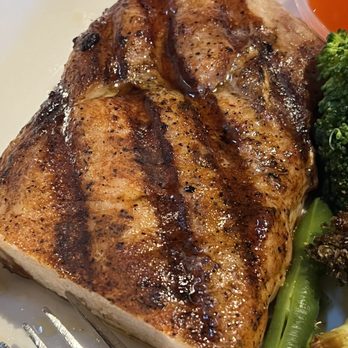 On The Patio - Cajun Tomahawk Pork Chop - Sports Bars Near Me - Azle, Texas On The Patio - Cajun Tomahawk Pork Chop - Sports Bars Near Me - Azle, Texas