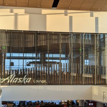 Alaska Lounge - North Satellite - View of lounge from top of escalator - Airport Lounges Near Me - Seattle, Washington Alaska Lounge - North Satellite - View of lounge from top of escalator - Airport Lounges Near Me - Seattle, Washington