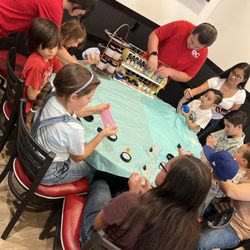 OC Fun Events - Children slime at the birthday celebration.