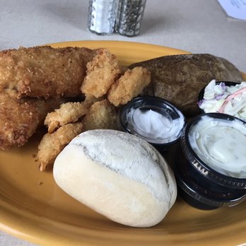 Riverside Inn - a plate of fried fish, breaded rolls, coleslaw, and coleslaw - American Near Me - Chisholm, Minnesota