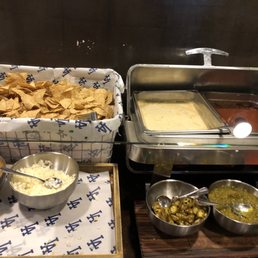 Nachos with white cheddar cheese and fixins Nachos with white cheddar cheese and fixins