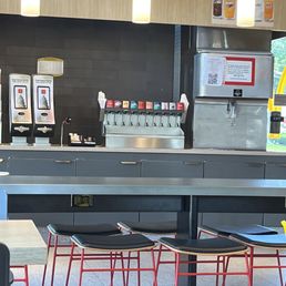 Self-serve fountain drinks and seating Self-serve fountain drinks and seating