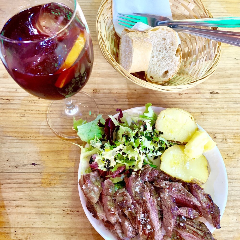 Half portion of grilled pork with potato, sangria from another booth Half portion of grilled pork with potato, sangria from another booth