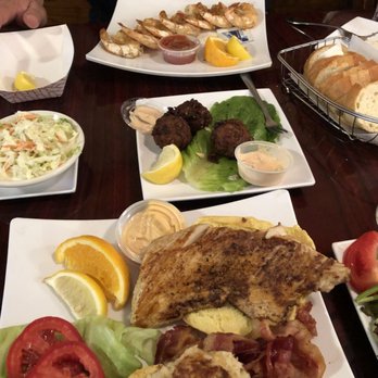 Papa’s Fish House - Mahi/crab cake sandwich. Conch fritters and peel and eat shrimp in the background. - Seafood Near Me - Lighthouse Point, Florida Papa’s Fish House - Mahi/crab cake sandwich. Conch fritters and peel and eat shrimp in the background. - Seafood Near Me - Lighthouse Point, Florida