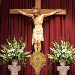 The Basilica of Sts. Peter & Paul - Sculpture of Jesus on the Cross which adorns the reredos at the front of the church.
