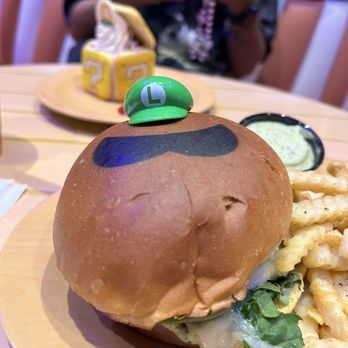 Toadstool Cafe - Luigi burger (chicken pesto) - Cafes Near Me - Universal City, California Toadstool Cafe - Luigi burger (chicken pesto) - Cafes Near Me - Universal City, California