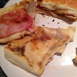 I opened the sandwich so you can see how a lot is missing in here, where's the cheese, pork & pickle??