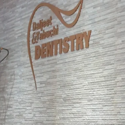 Daljeet & Tabuchi Dentistry - logo on the wall