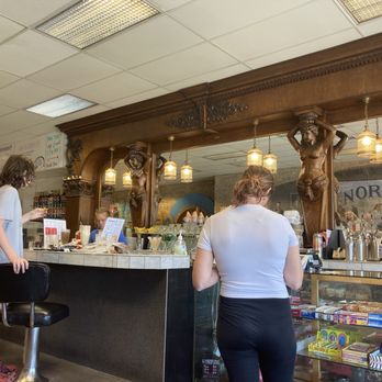 Norm's Soda Fountain - Carved wooden bar - American Near Me - Kalispell, Montana